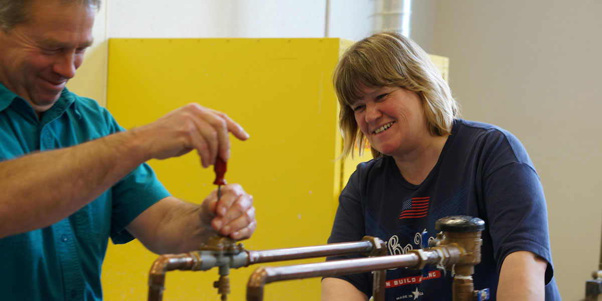 Instructor demonstrates backflow connections